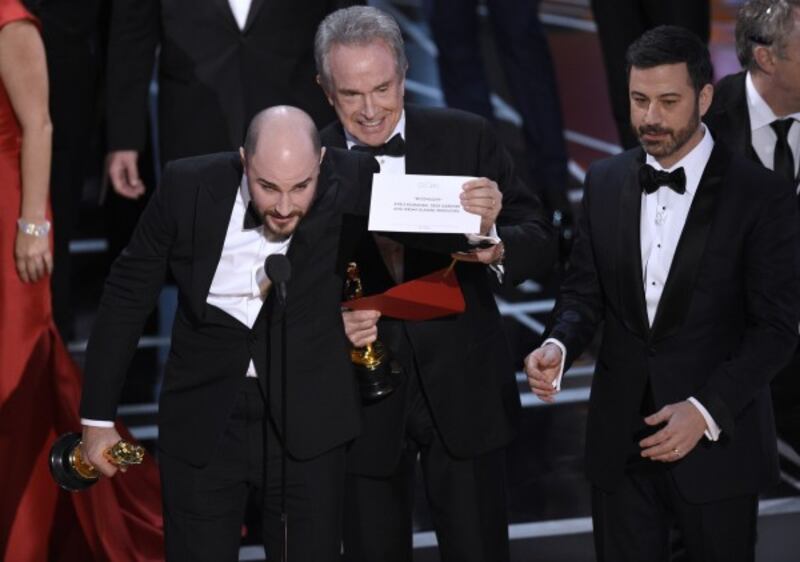 La La Land producer Jordan Horowitz, Warren Beatty and Jimmy Kimmel during the Oscars mix-up ( Chris Pizzello/AP)