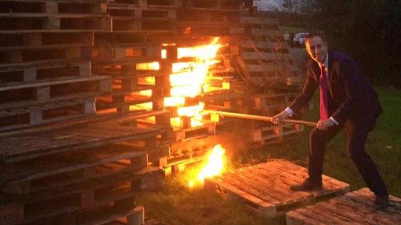 DUP communities minister Paul Givan lights an Eleventh Night bonfire 