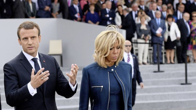 Brigitte Macron pictured with her husband, French President Emmanuel Macron. The 65-year-old style icon can often be seen at official events dressed in a mini-skirt ensemble and why not, she looks fabulous. Photo by Christophe Archambault via AP 