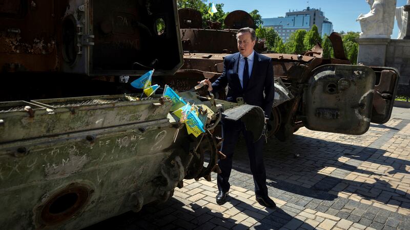 Foreign Secretary Lord David Cameron walks past a display of destroyed Russian military vehicles in Saint Michael’s Square, in Kyiv (Thomas Peter/Pool via AP)