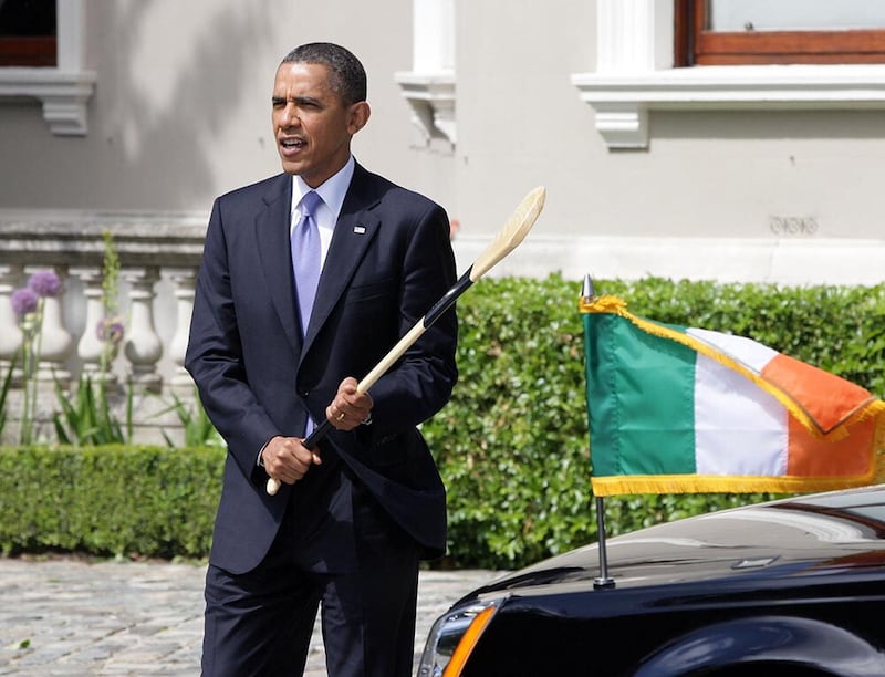 President Barack Obama holds a hurling stick presented  to him by Taoiseach Enda Kenny in Farmleigh, Dublin, where the two held talks. Picture date: Monday May 23 2011
