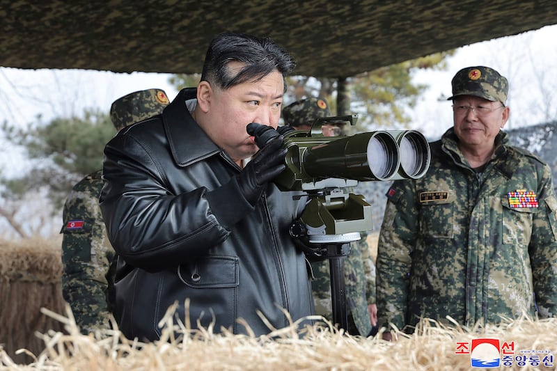 It is the third time that Kim Jong Un has been seen observing military drills, following visits to observe artillery firing drills earlier in March (Korean Central News Agency/Korea News Service via AP)