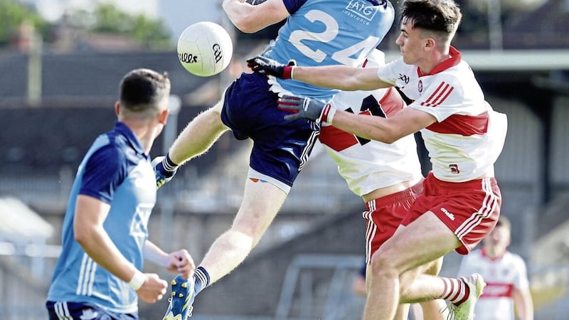 Derry's Finbar Murray contests possession with Dublin's Niall O'Brien during last night's Electric Ireland All-Ireland MFC semi-final at the BOX-IT Athletic Grounds Picture by Philip Walsh 