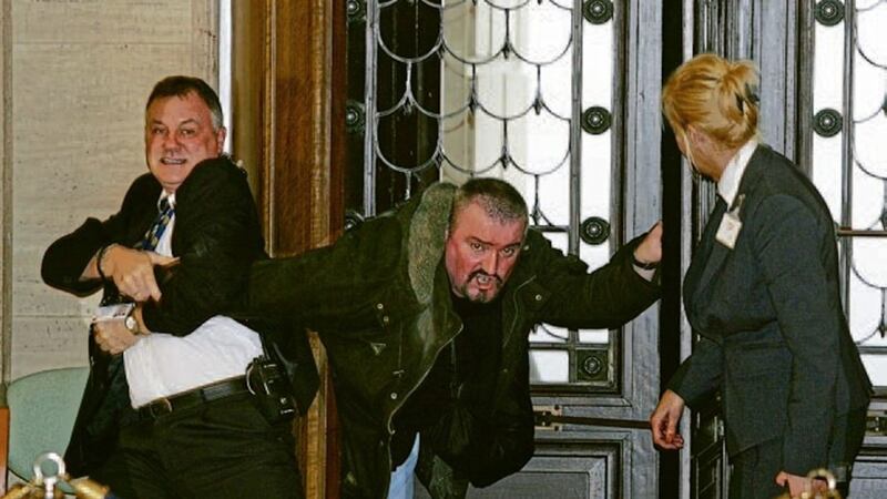 Stormont security staff struggle with loyalist Michael Stone at the entrance to the Assembly in November 2006. Picture by Mal McCann 