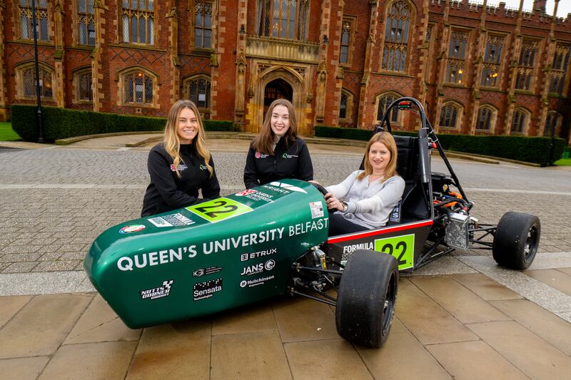 Bernie Collins pictured with students from Queen’s Formula Student team. (Queen’s University Belfast)