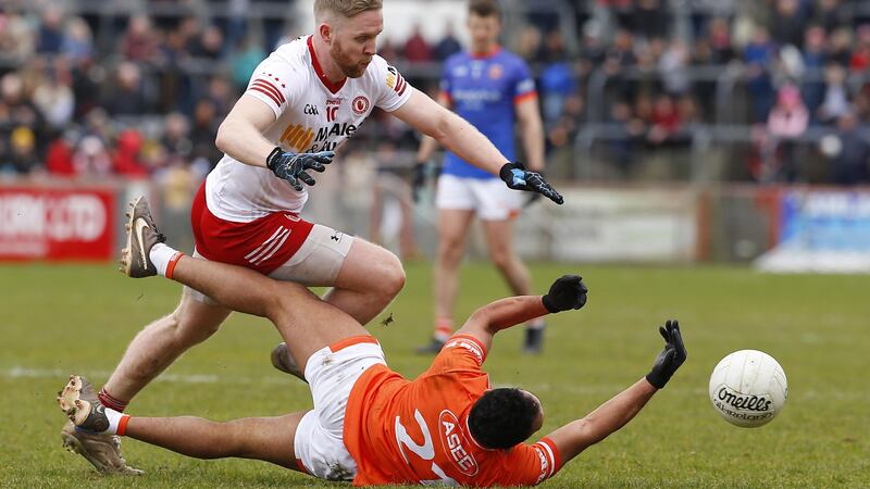 Frank Burns wins the ball back against Armagh in th final Division One clash