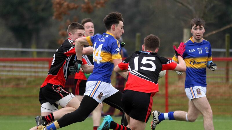 Eamon&nbsp;Fyfe (14) bursts through the St Eunan's defence to score the goal that sent St Louis on their road to victory in Saturday's MacLarnon Cup quarter-final at Owenbeg<br />&nbsp;