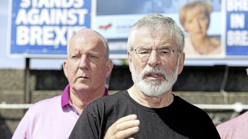 Gerry Adams and Bobby Storey after their homes were attacked in July 