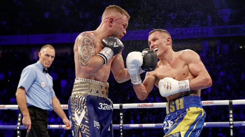 Josh Warrington (right) and Carl Frampton in action in the World Featherweight Championship at Manchester Arena in December 