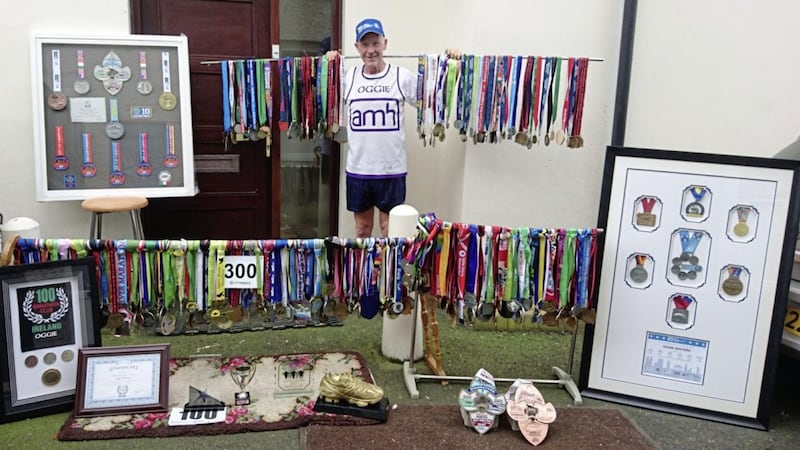 Oggie pictured with his 300-plus marathon medals 