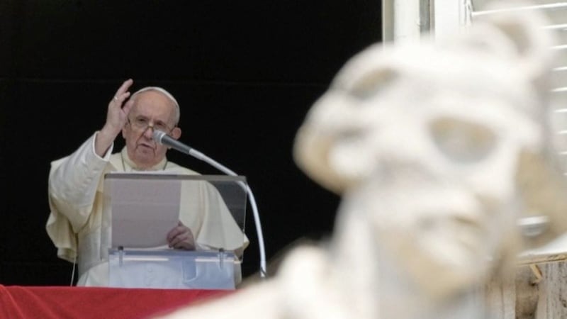 Pope Francis delivers his blessing as he recites the Angelus noon prayer from the window of his studio overlooking St Peter&#39;s Square, at the Vatican, on Sunday. Picture by Andrew Medichini, Associated Press 