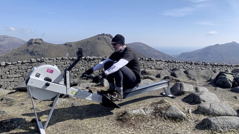 Saintfield sportsman and fitness coach Ian Young high in the Mourne Mountains, where he&#39;s taking on a rowing-machine challenge during the Darkness Into Light suicide and mental health awareness event 