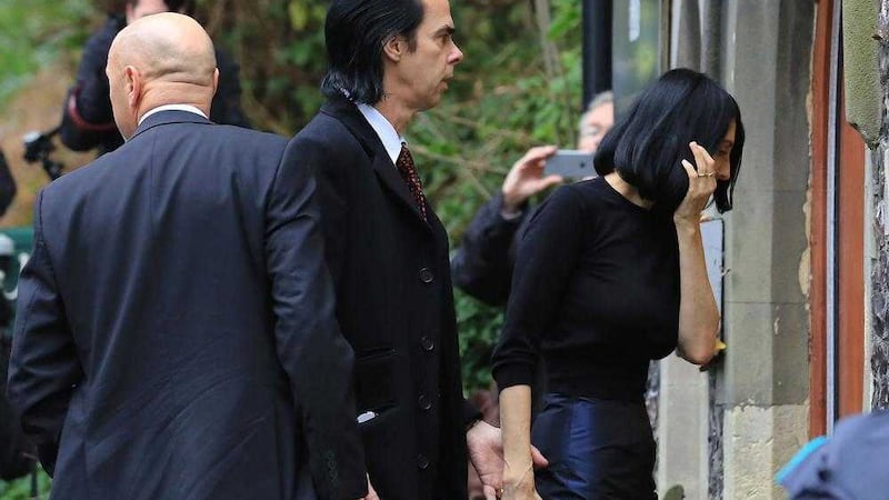 Musician Nick Cave and his wife Susie Bick arrive at the Coroners Court in Brighton, Sussex for the inquest into the death of their son Arthur.  Picture by Gareth Fuller/PA