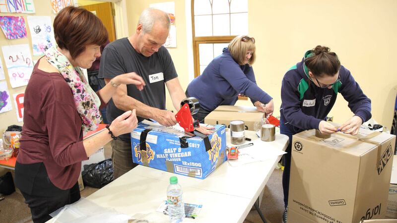 Volunteers sort and pack large quantities of donated clothing and household items at Mayfield community hall over the weekend for transport to Syrian refugees         &nbsp;