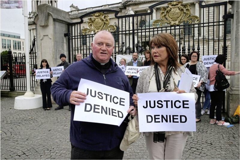 Margaret McGuckin of pressure group SAVIA and FR Patrick McCafferty at the survivors Vigil outside Belfast City Hall Picture by Hugh Russell. 