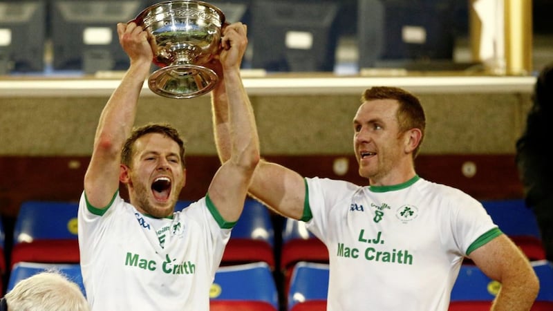 Ederney St Joseph&rsquo;s captain Declan McCusker and midfielder Martin McGrath (right) lift the New York Cup as Fermanagh SFC champions.<br /> Pic Philip Walsh