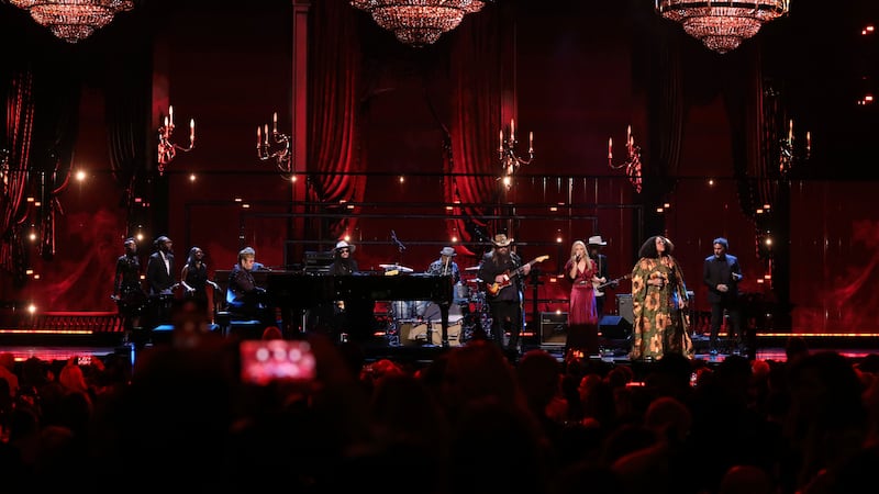 Elton John, Chris Stapleton, Sheryl Crow and Brittany Howard perform a tribute to Robbie Robertson during the in memoriam segment of the Rock & Roll Hall of Fame Induction Ceremony on Friday (Andy Kropa/Invision/AP)