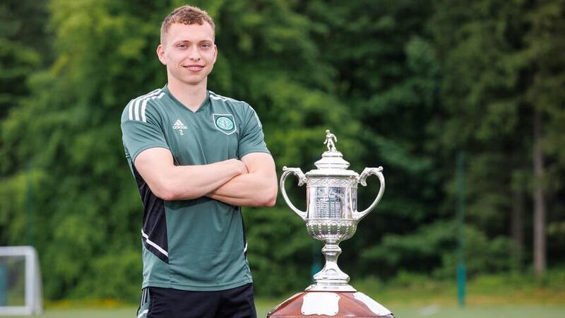 Celtic’s Alistair Johnston alongside the Scottish Cup (Steve Welsh/PA)