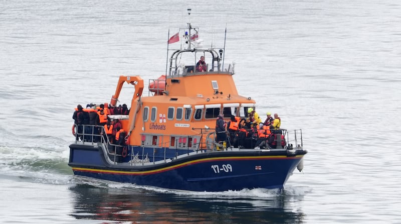 A group of people thought to be migrants are brought in to Dover, Kent on Tuesday