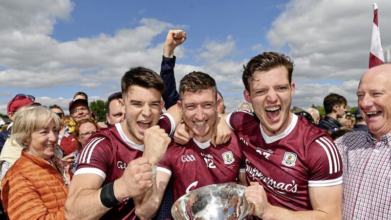 29 May 2022; Galway players, from left, Tomo Culhane, Johnny Heaney and Owen Gallagher celebrate with the cup after their side&#39;s victory in the Connacht GAA Football Senior Championship Final match between Galway and Roscommon at Pearse Stadium in Galway. Photo by Sam Barnes/Sportsfile 
