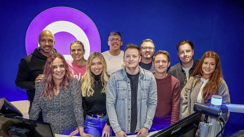 MOVING ON UP: Q Radio presenters with programme manager Errol Doherty and Group head of station sound Carl Kinsman. Picture: Mal McCann 