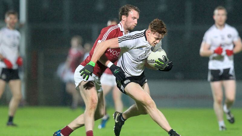 Slaughtneil's Padraig Cassidy with Conor Meyler of Omagh Picture by Margaret McLaughlin&nbsp;