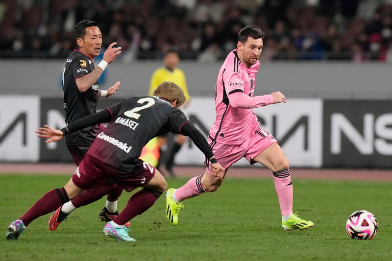 Lionel Messi (right) looked to make an impact from the bench, but the game finished goalless (Eugene Hoshiko/AP)