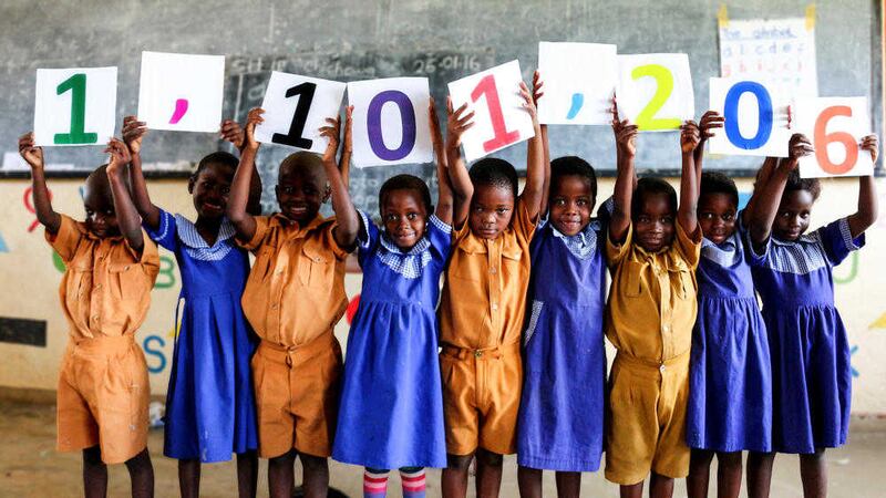 Children in Malawi, where 814,000 school children currently receive Mary&#39;s Meals, celebrate the charity providing 1,101,206 of the world&#39;s poorest children with a daily meal in school 