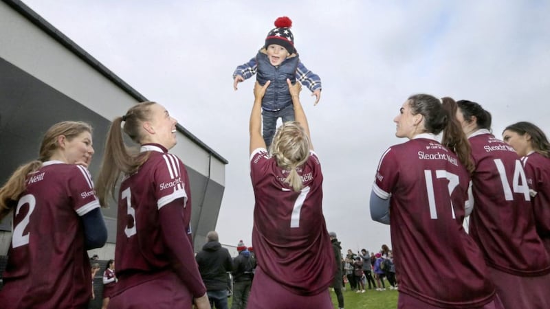 Slaughtneil kid Frankie McGrath roars with delight as his mum Clare McGrath (7) lifts him in the air as they wait during the cup presentation following Slaughtneil&#39;s six in a row Ulster Camogie Senior Club Championship wins after they beat Loughgiel in the final played at Lavey in Co-Derry on Saturday. Picture Margaret McLaughlin  15-1-2022. 