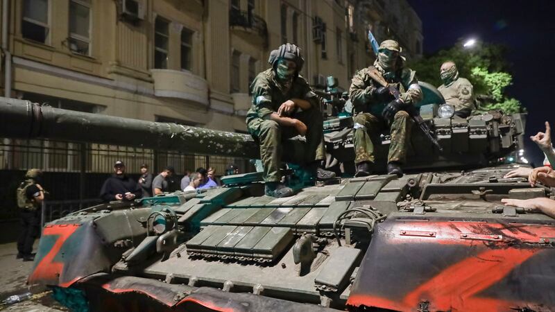 Members of the Wagner Group military company sit atop a tank on a street in Rostov-on-Don, Russia (AP)