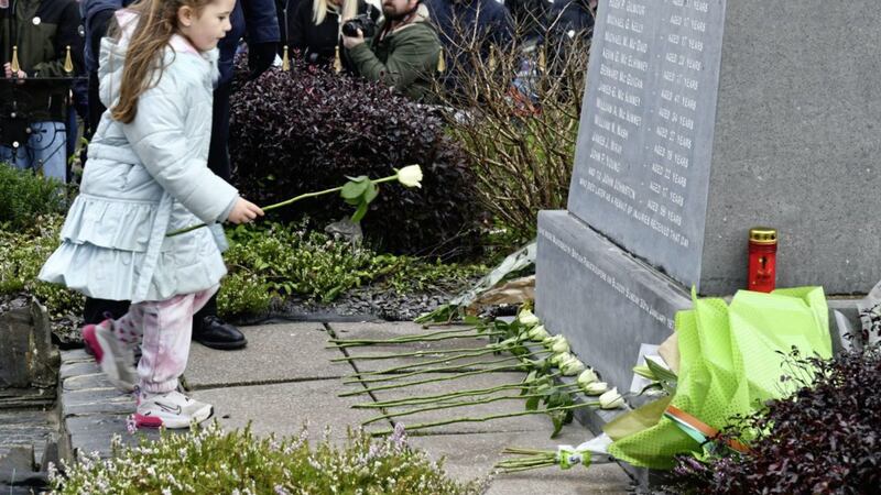 Family members laying flowers at the Bloody Sunday Memorial in Derry on the 50th anniversary of the killings. Picture by Alan Lewis, Photopress 