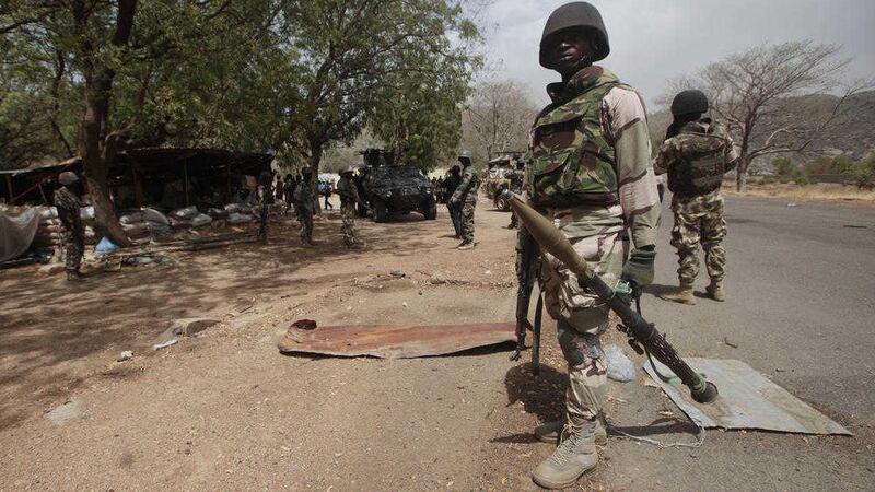 Nigerian soldiers man a checkpoint in Gwoza, Nigeria, a town liberated from Boko Haram. Picture by Lekan Oyekanmi, Associated Press