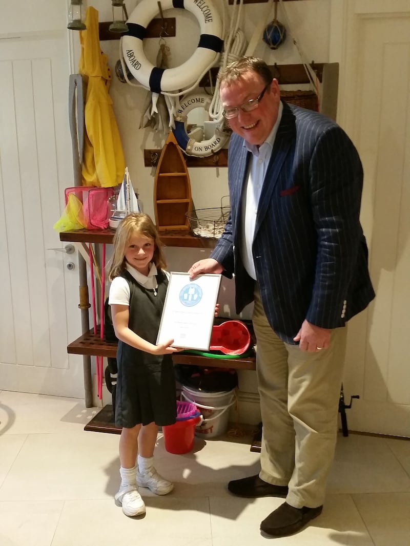 Ella giving an award to the Salcombe Harbour Hotel 