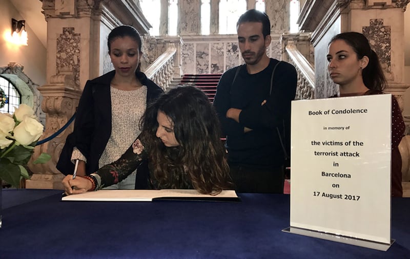 Spanish nationals in Belfast sign the book of condolence at City Hall for victims of the attacks&nbsp;