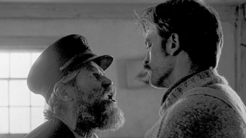 Willem Dafoe as Thomas Wake and Robert Pattinson as Ephraim Winslow in The Lighthouse 