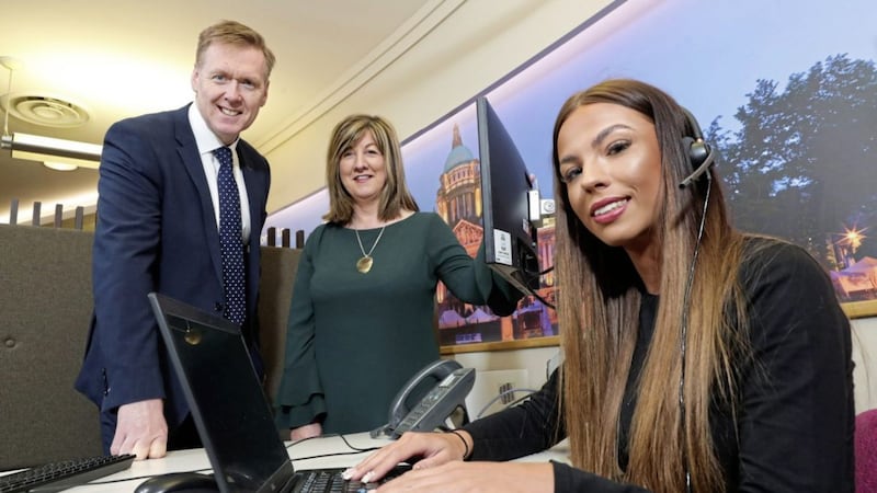 Ulster Bank&#39;s Mark Crimmins and Joanne Wilson with customer service representative Caitlin Lyttle at the bank&#39;s headquarters in Belfast 