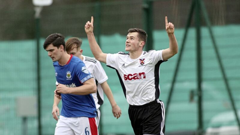 Queen&#39;s Jonah Mitchell celebrates his penalty against Linfield in the last round of the Irish Cup. 