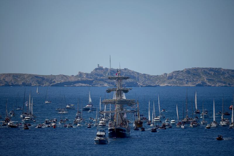 The Belem is accompanied by other boats approaching Marseille (Daniel Cole/AP)