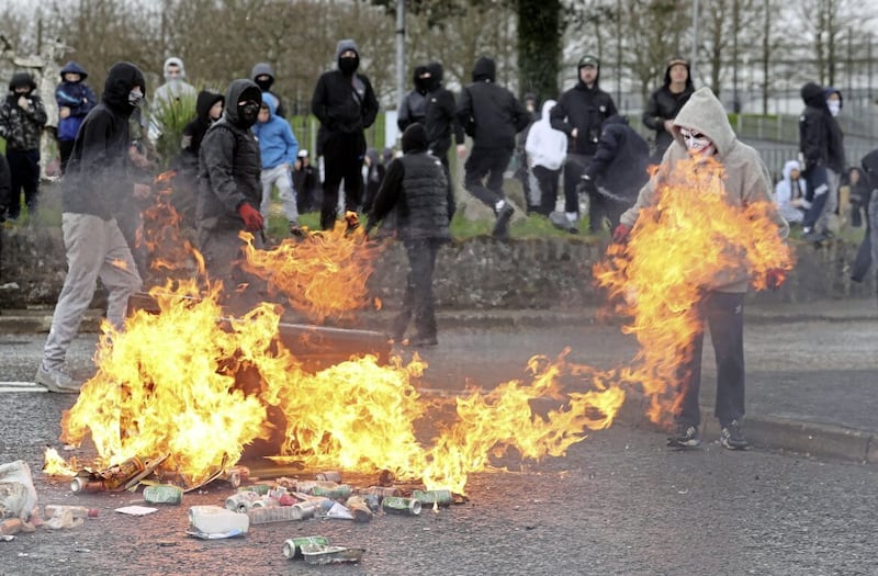 Youths throwing petrol bombs in the Creggan area of Derry earlier this year. Picture by Liam McBurney/PA Wire. 