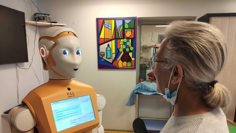 A Spring robot converses with a hospital staff worker