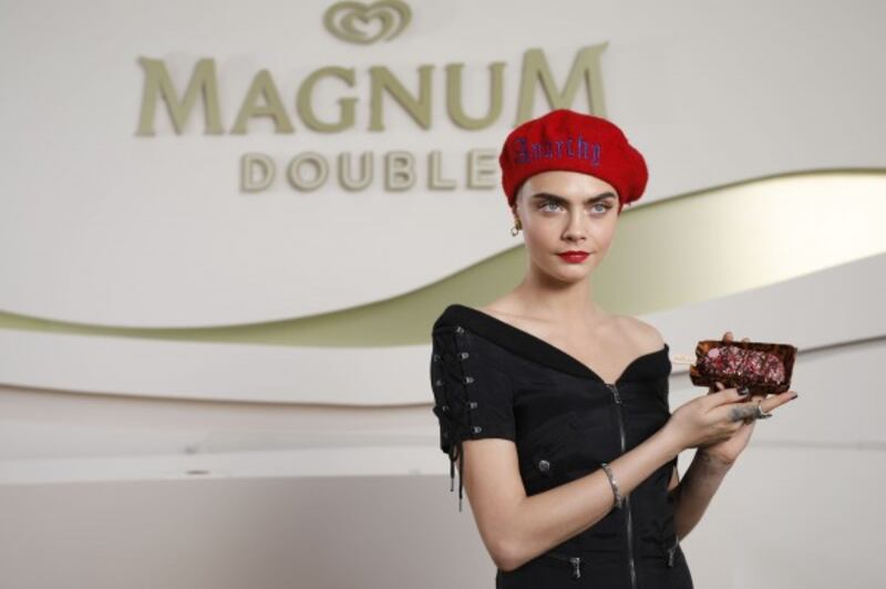 Cara models her own ice cream at Cannes.