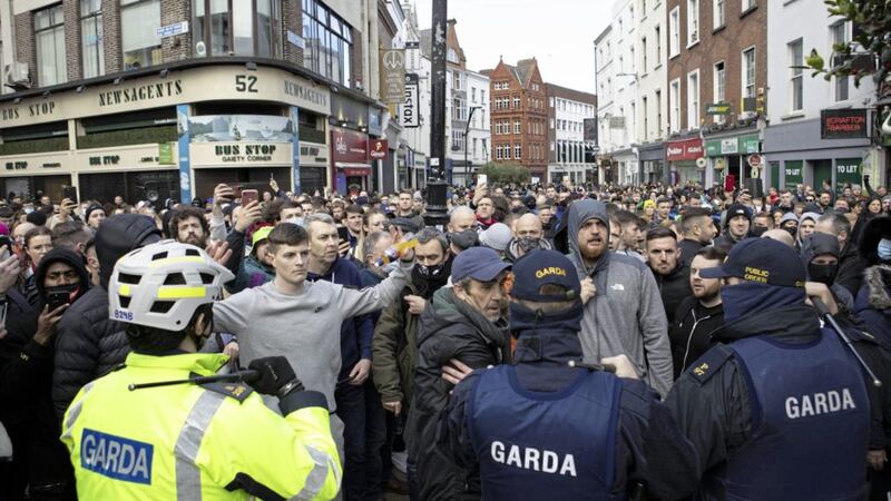 Garda&iacute; talking to protesters during an anti-lockdown demonstration in Dublin city centre 