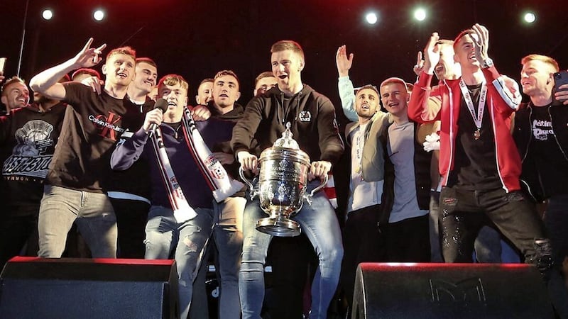 The Derry City squad celebrate with the FAI Cup trophy at last night&#39;s homecoming for the team at Guildhall Square. Picture by Margaret McLaughlin 