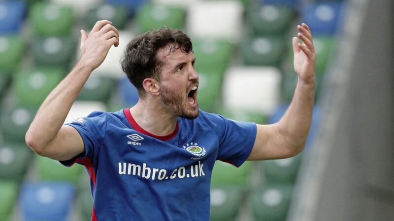 Linfield&#39;s Joshua Robinson celebrates scoring the winner in Saturday&#39;s game at Windsor Park Picture by Pacemaker 