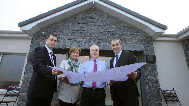 Philip McNeill Ulster Bank, William Hamilton, Heather Hamilton, and Nigel Walsh, Ulster Bank view progress on the home extension 