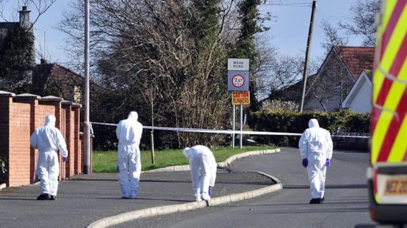 Forensic officers at the scene of the car bomb that killed Constable Ronan Kerr in Omagh in April 2011	&nbsp;