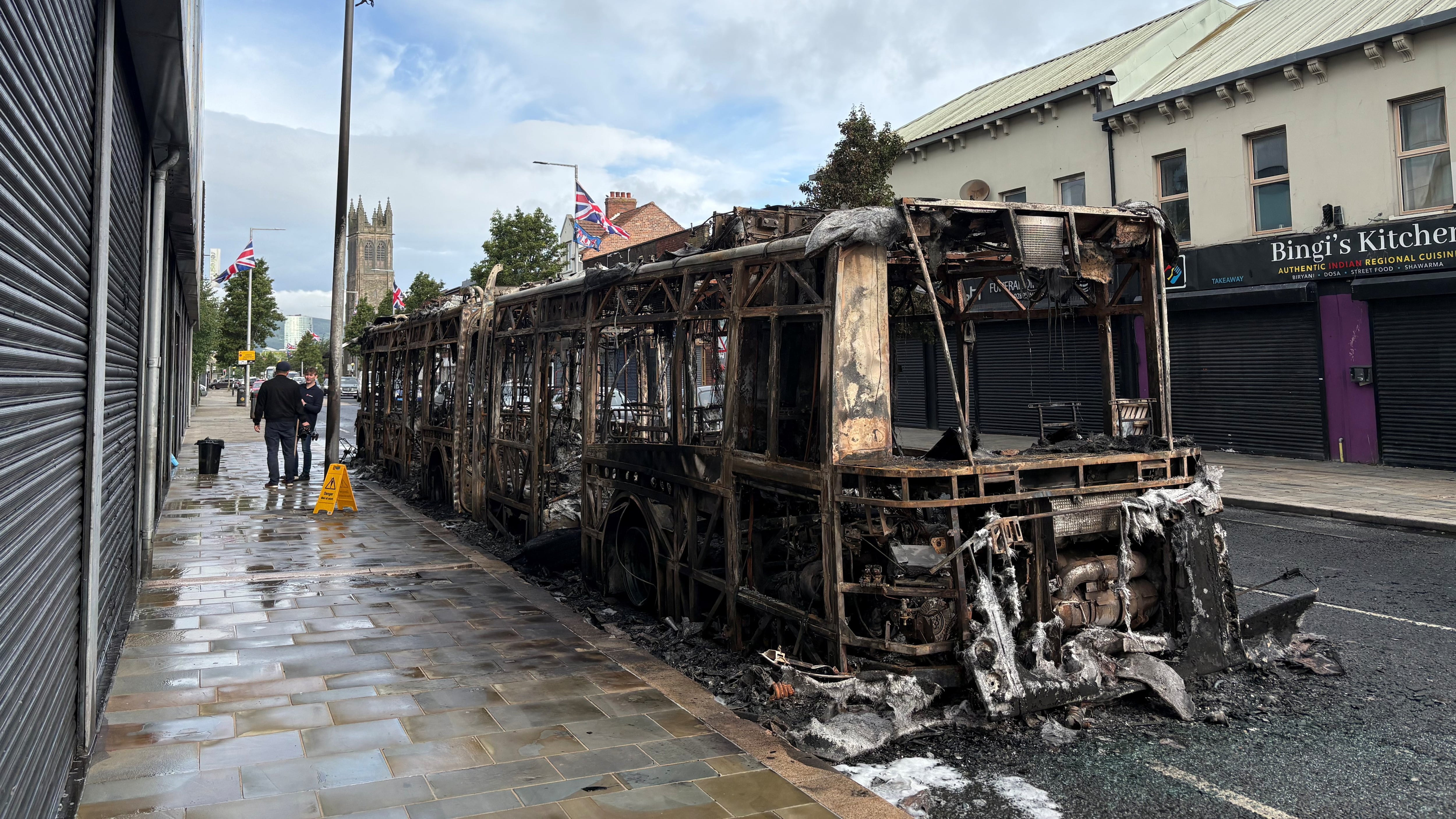 A burned-out Glider bus on Newtownards Road in east Belfast after violence erupted on Tuesday