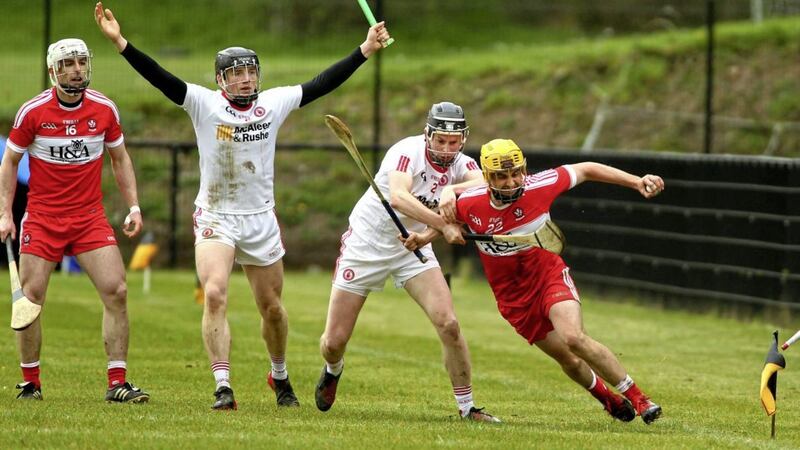 Derry&#39;s Cian Waldron comes under pressure from Tyrone&#39;s Padraig McHugh and Lorcan Devlin in the Ulster Shield final at Carrickmore. Picture by Seamus Loughran 