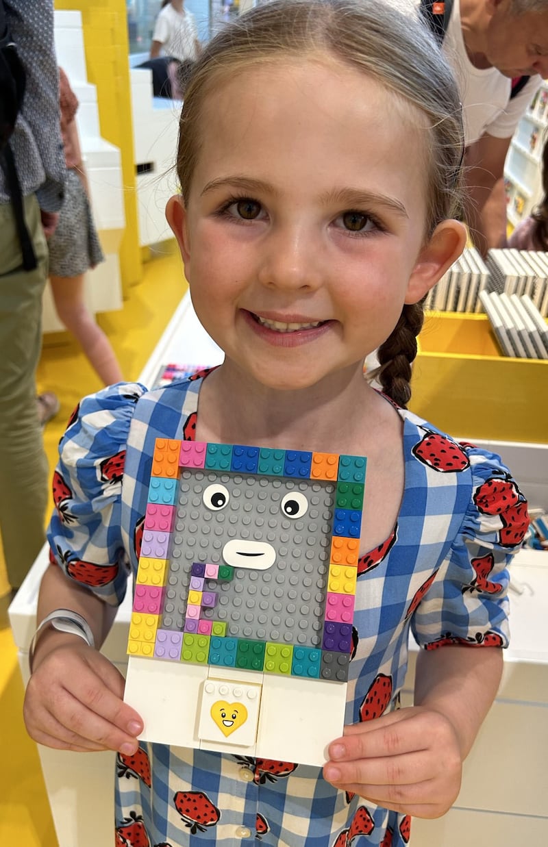 Evie, six, built an interactive character using the Mood Mixer in the yellow zone of Lego House, Billund.