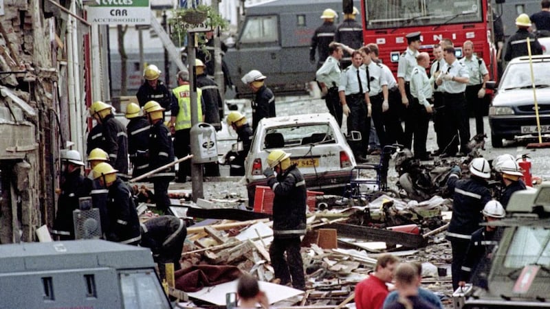 Police and firefighters in the aftermath of the Omagh bomb in 1998. Picture by Paul McErlane/PA Wire 
